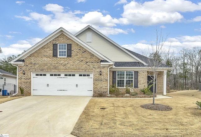 view of front of house featuring a garage, brick siding, driveway, and a shingled roof