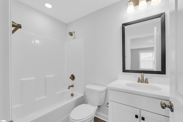 full bathroom featuring shower / tub combination, vanity, and toilet