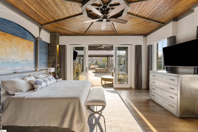 bedroom with access to exterior, wooden ceiling, multiple windows, and wood finished floors