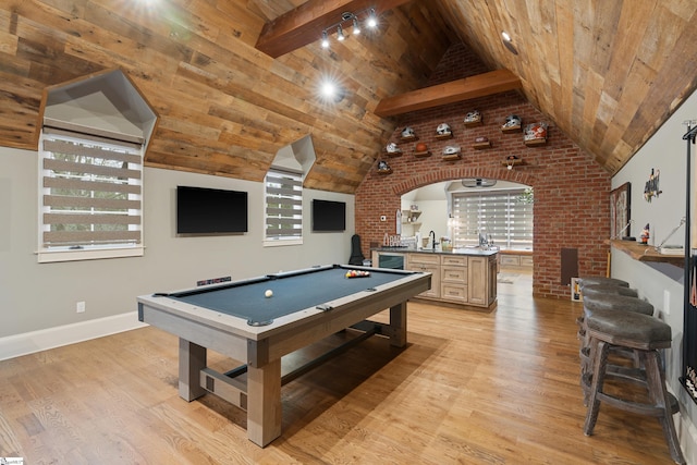 game room with vaulted ceiling with beams, wooden ceiling, pool table, wet bar, and light wood finished floors