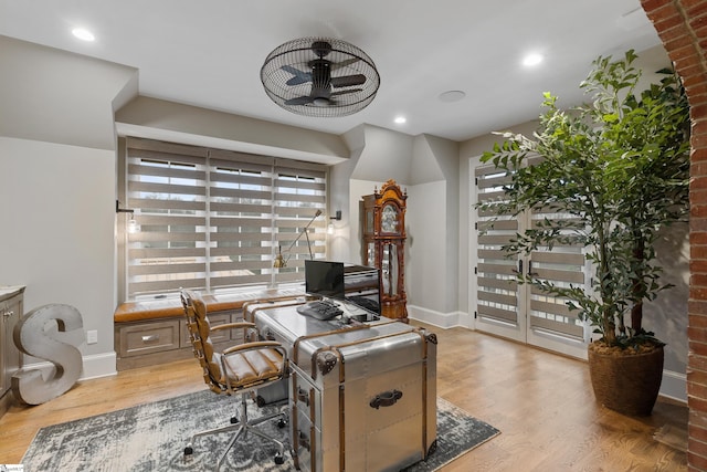 home office with recessed lighting, light wood-type flooring, and baseboards