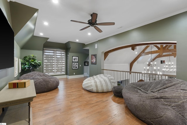 interior space with baseboards, visible vents, lofted ceiling, wood finished floors, and recessed lighting