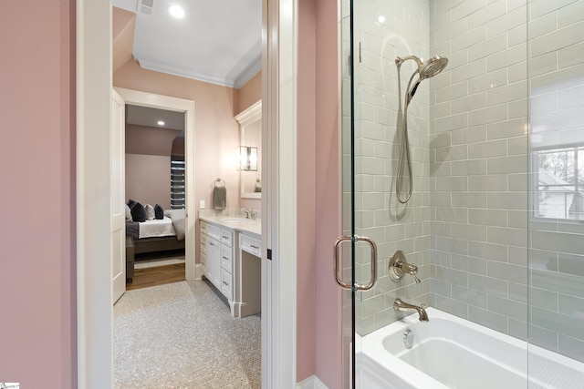 ensuite bathroom with ensuite bathroom, visible vents, vanity, shower / washtub combination, and ornamental molding