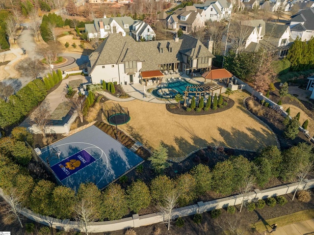 birds eye view of property with a residential view