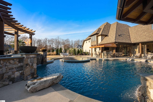 pool with outdoor dry bar, a patio, and a pergola