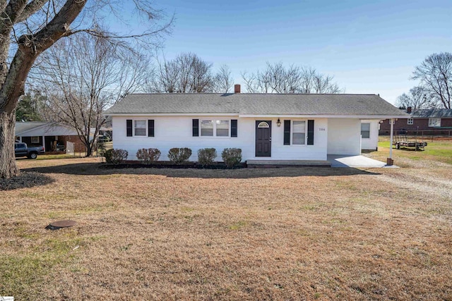 ranch-style home featuring a front yard