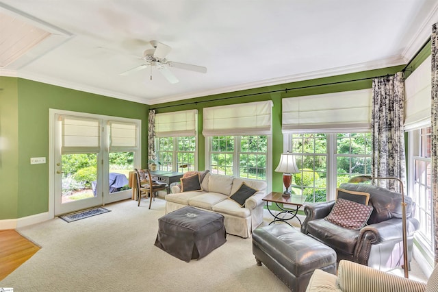 sunroom / solarium with a ceiling fan