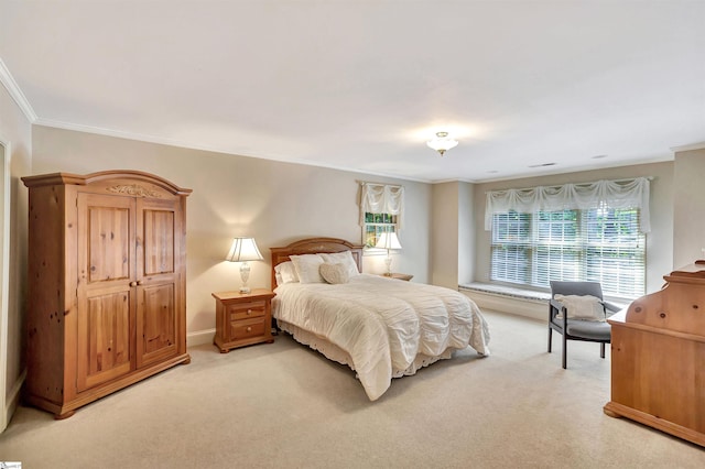 bedroom featuring ornamental molding and light colored carpet