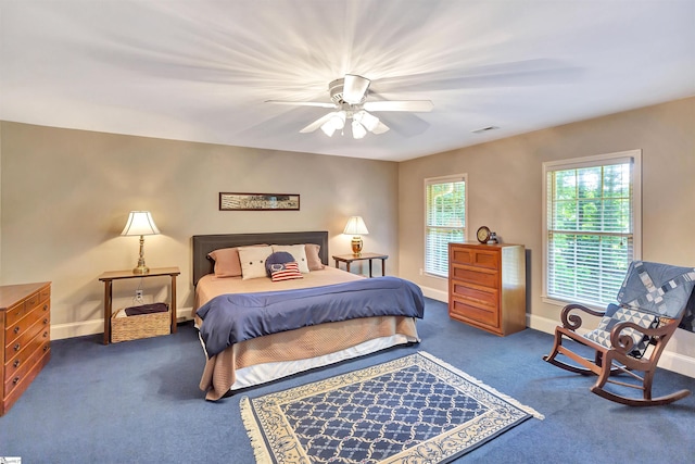 carpeted bedroom with visible vents, ceiling fan, and baseboards