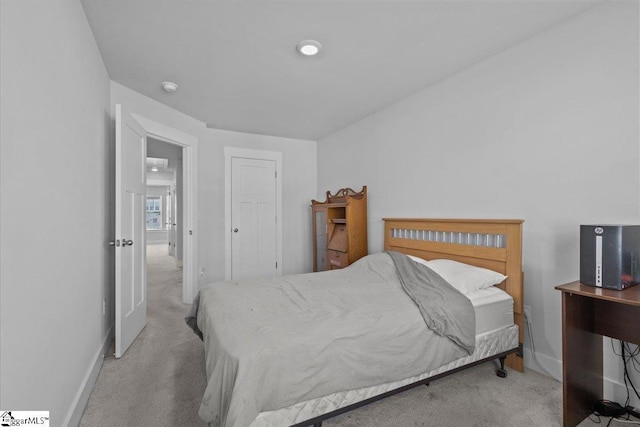 bedroom featuring carpet flooring and baseboards