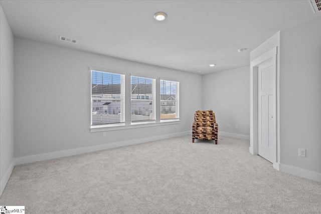 unfurnished room featuring carpet, visible vents, baseboards, and recessed lighting