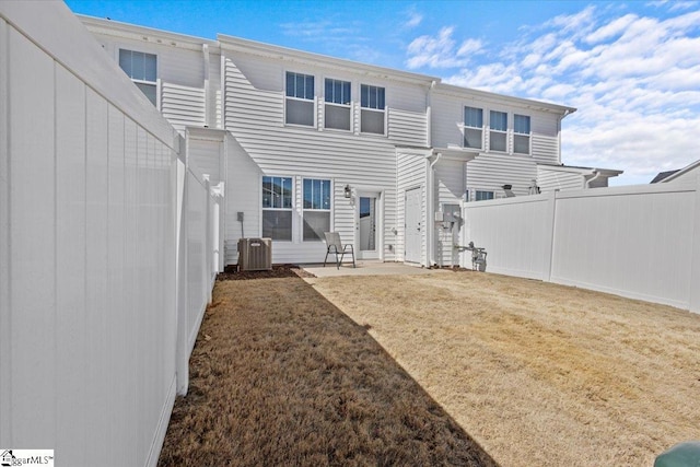 back of house with cooling unit, fence, a patio, and a yard