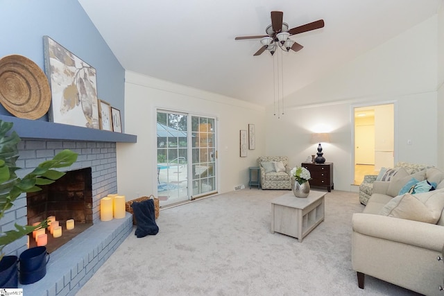 living room with vaulted ceiling, carpet, a ceiling fan, and a brick fireplace