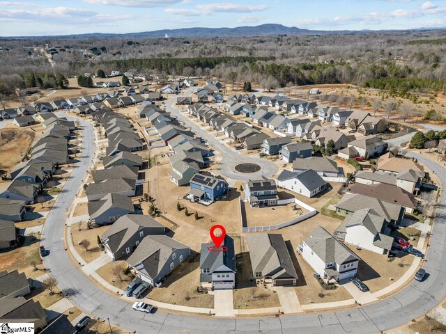 drone / aerial view with a residential view and a mountain view