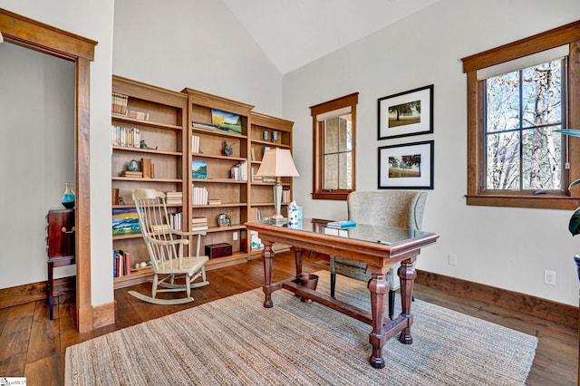 home office with lofted ceiling, baseboards, and hardwood / wood-style floors