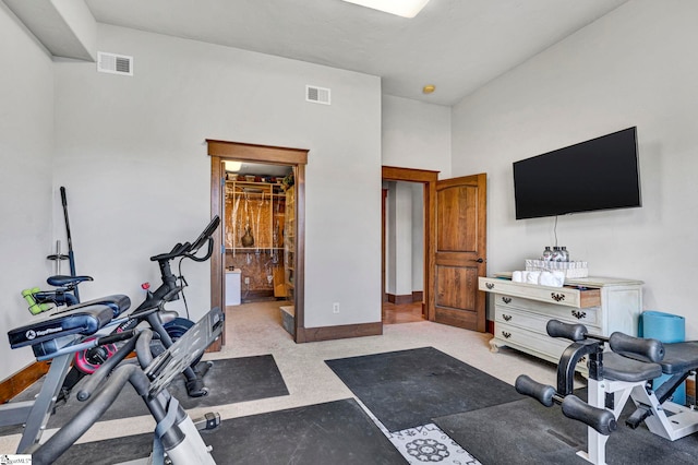 exercise area featuring baseboards and visible vents