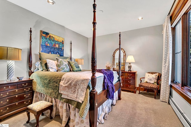 carpeted bedroom with baseboard heating and recessed lighting