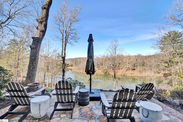 view of patio / terrace with a forest view