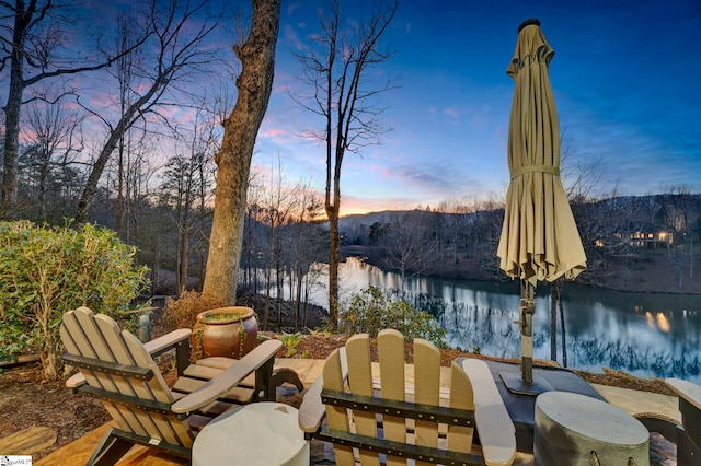 patio terrace at dusk with a water view