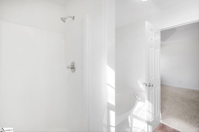 bathroom with a shower and a tub to relax in