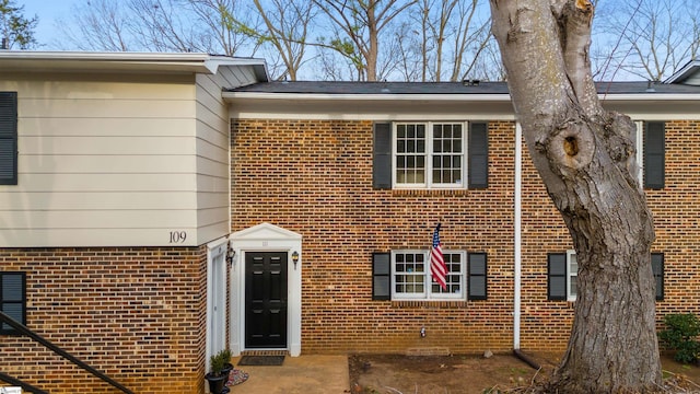 view of front of house with brick siding