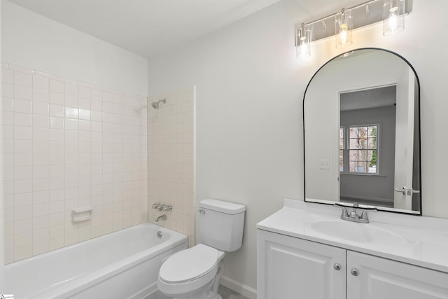 full bathroom with shower / bath combination, vanity, toilet, and baseboards