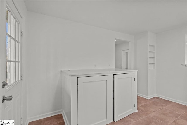 interior space with baseboards