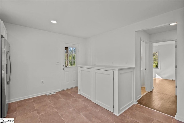 interior space featuring recessed lighting and baseboards