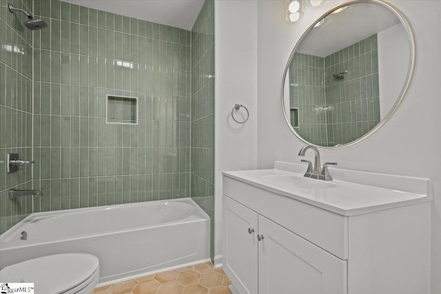 bathroom with tile patterned flooring, shower / bathing tub combination, vanity, and toilet