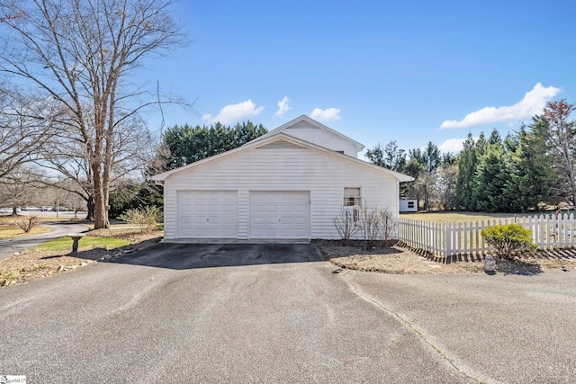 garage with fence