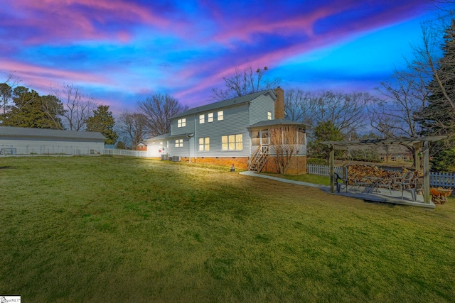 rear view of property featuring crawl space, a chimney, and fence