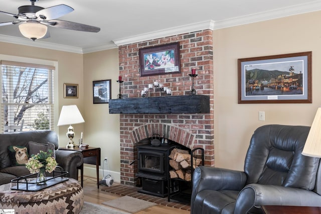 living room featuring ornamental molding, wood finished floors, a wood stove, and baseboards