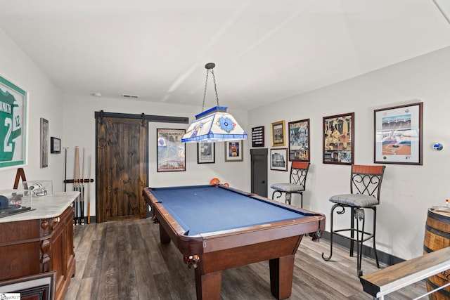 recreation room featuring dark wood-style floors, a barn door, and pool table