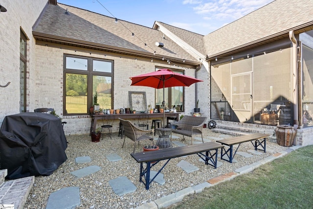 view of patio with a sunroom, outdoor lounge area, and grilling area