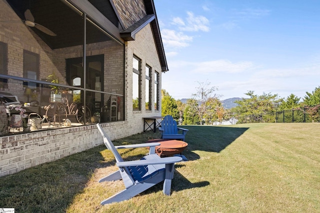 view of yard featuring a ceiling fan