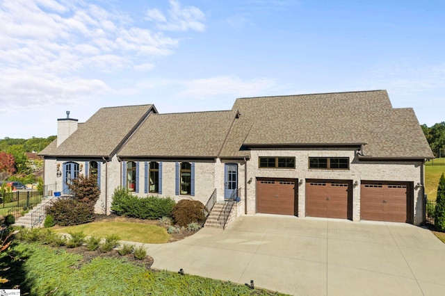 view of front of house with a garage, fence, driveway, roof with shingles, and a chimney