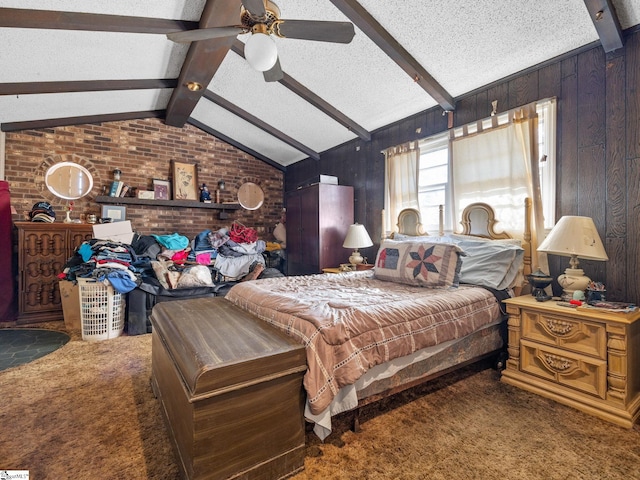 carpeted bedroom with a ceiling fan, wood walls, a textured ceiling, and lofted ceiling with beams