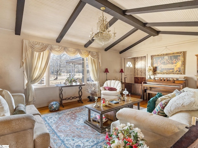 living room with a notable chandelier, vaulted ceiling with beams, and wood finished floors