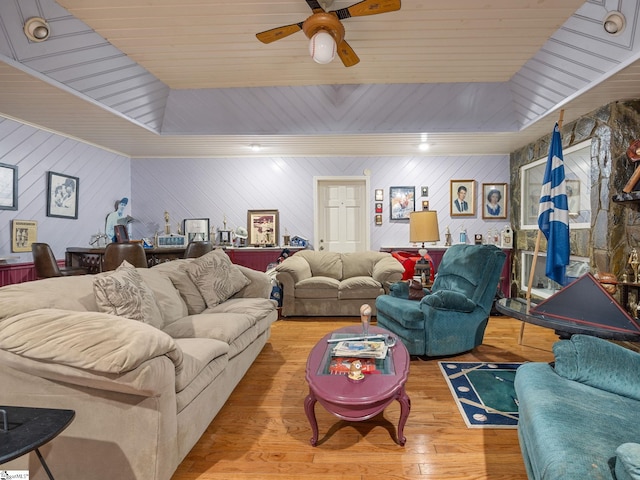 living room with ceiling fan and wood finished floors