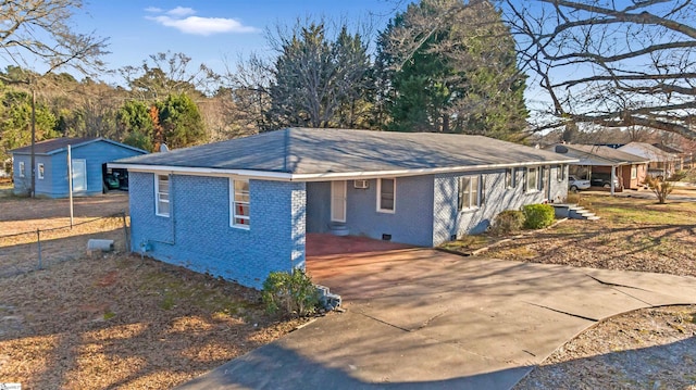 view of front of house with brick siding and crawl space