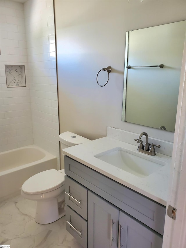 full bathroom featuring marble finish floor, vanity, and toilet