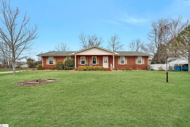 single story home with brick siding, fence, and a front lawn