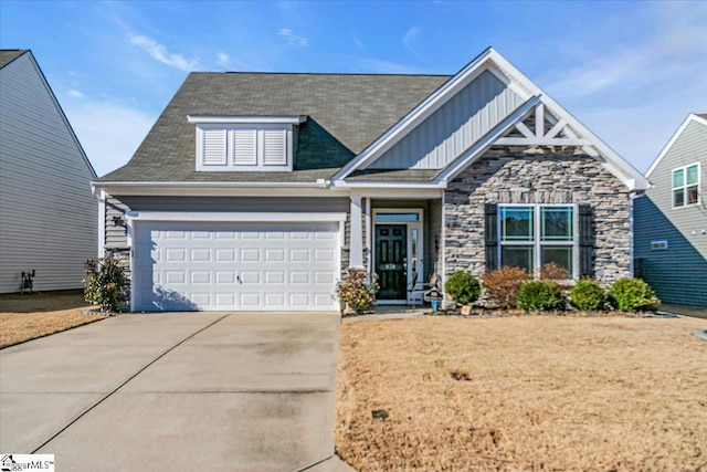 craftsman inspired home featuring driveway, board and batten siding, and stone siding