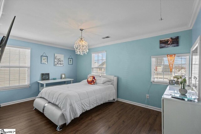 bedroom with baseboards, dark wood finished floors, and crown molding