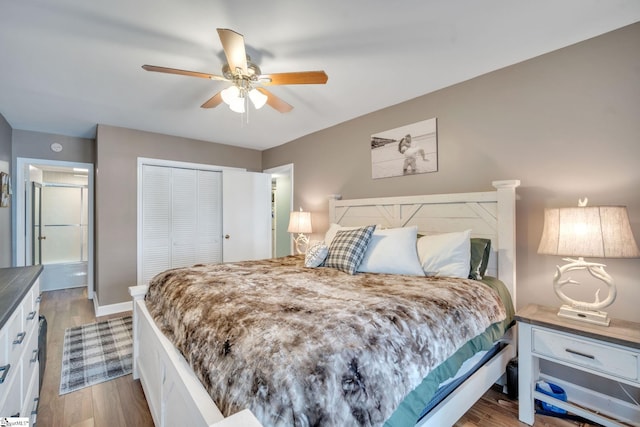 bedroom featuring ceiling fan, a closet, wood finished floors, and baseboards