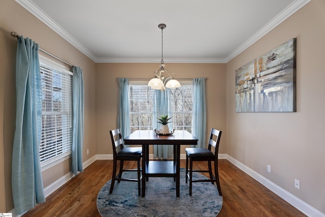 dining area featuring baseboards, a chandelier, dark wood-type flooring, and ornamental molding