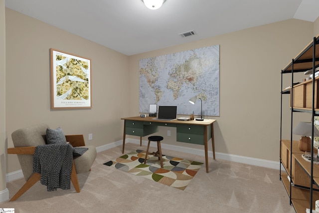 carpeted office featuring baseboards, visible vents, and vaulted ceiling