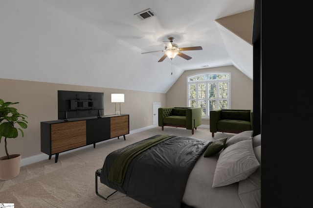 bedroom featuring lofted ceiling, baseboards, visible vents, and light colored carpet