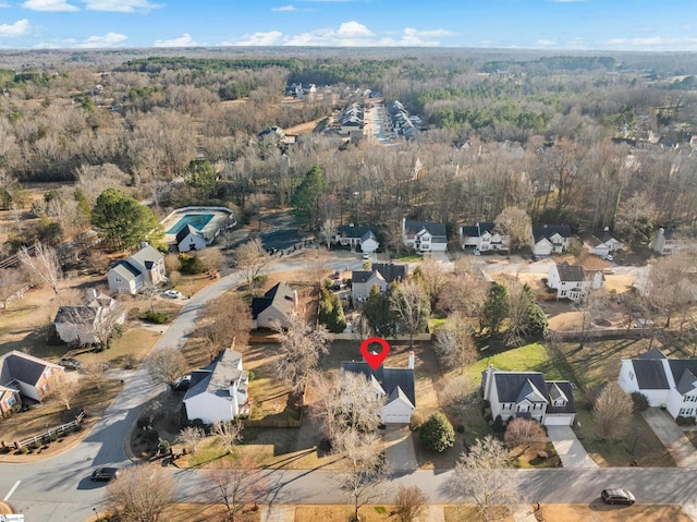 bird's eye view featuring a residential view and a view of trees