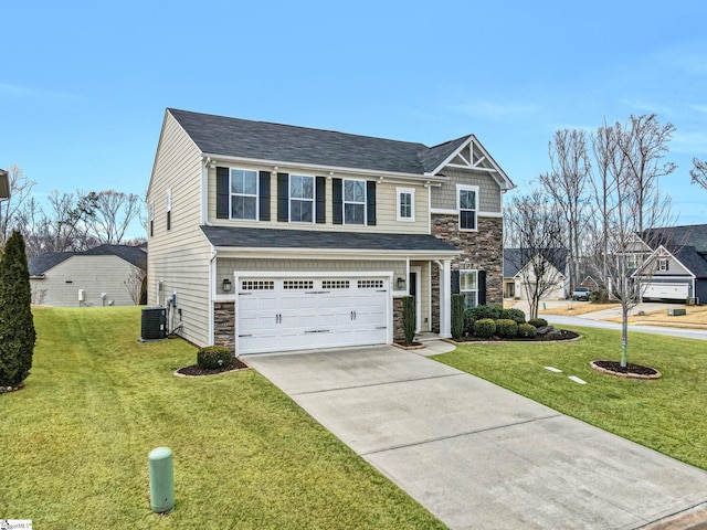 view of front of home with stone siding, a front yard, and driveway